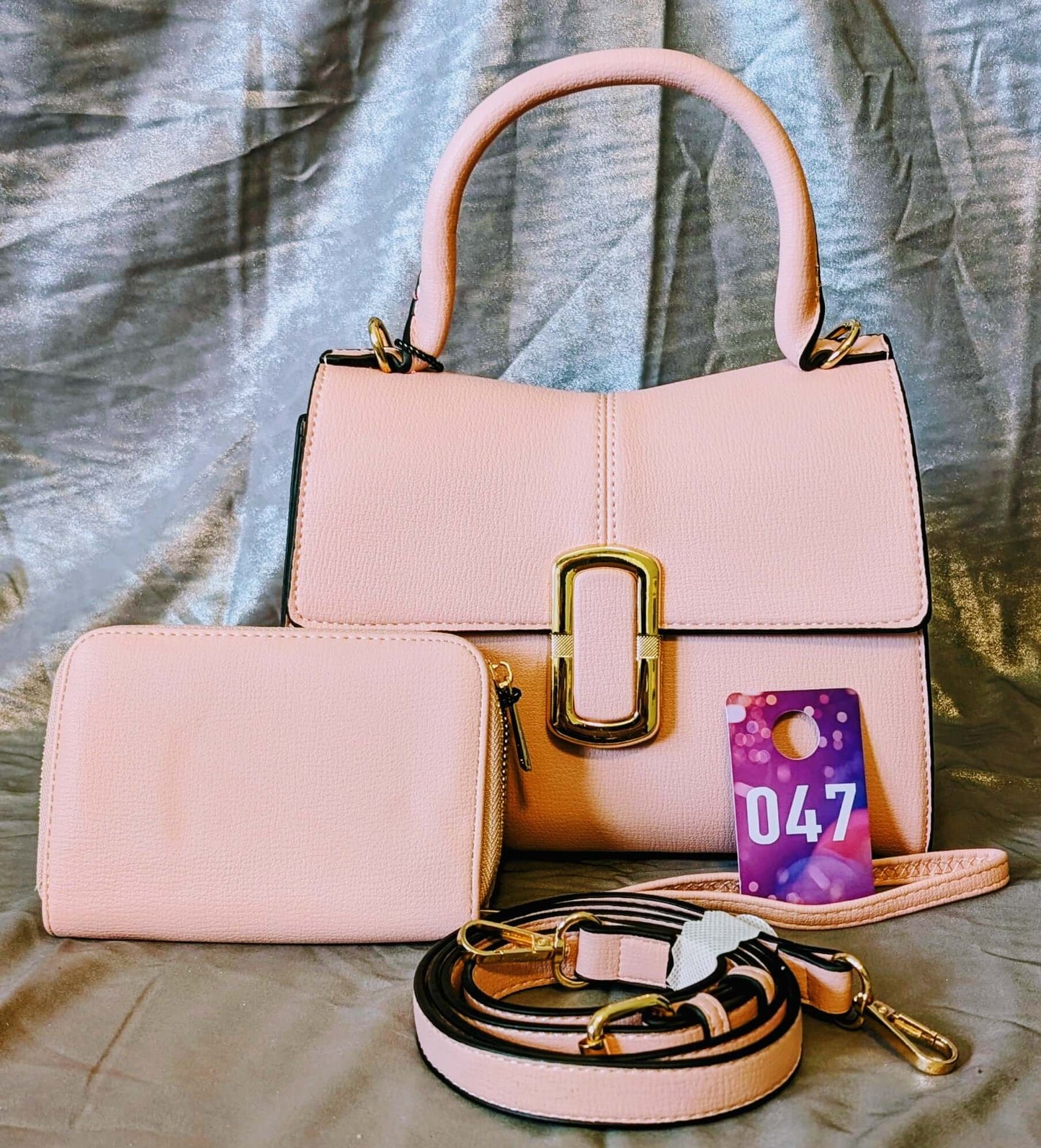 Blush Pink Structured Gold Buckle Handbag Set with matching zip wallet and strap on a soft background.